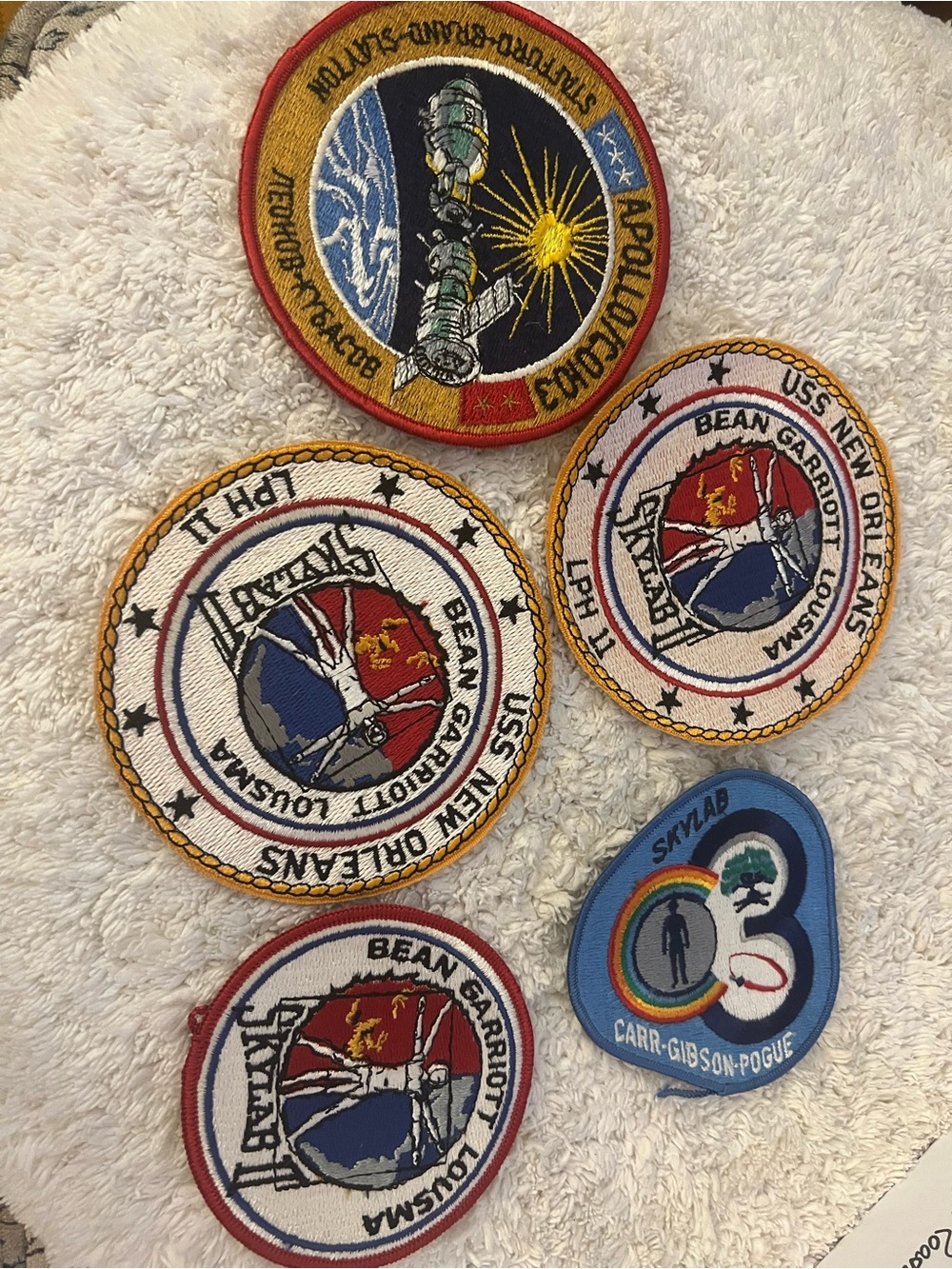 A collection of 4 embroidered NASA mission patches. See description for details.